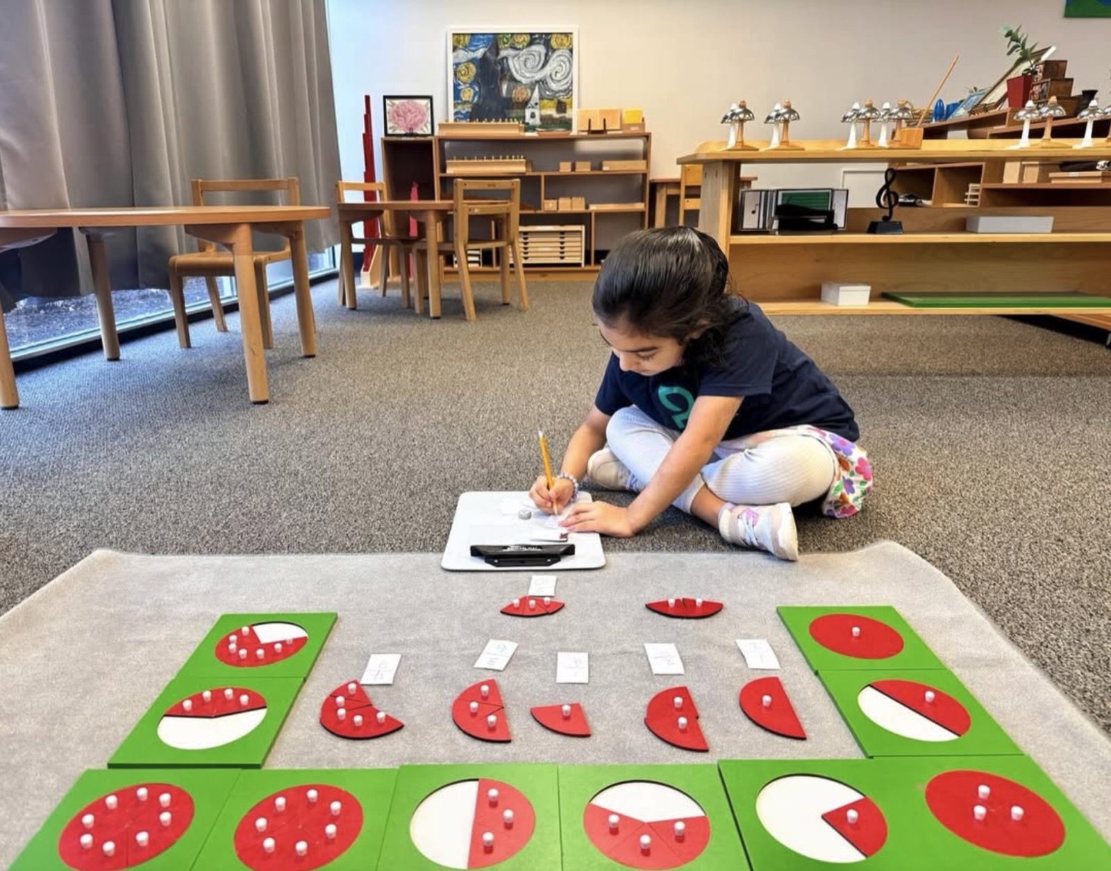Primary child working with the fraction materials